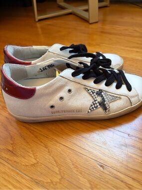 Golden Goose White Sneakers with Gold Tongue Plate and Red Heel